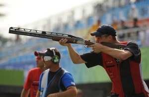 man firing rifle 
