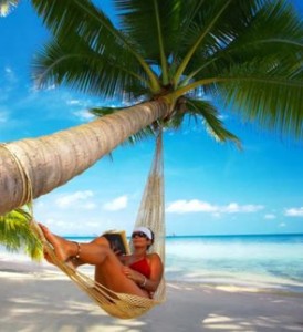 Woman in hammock on coconut tree
